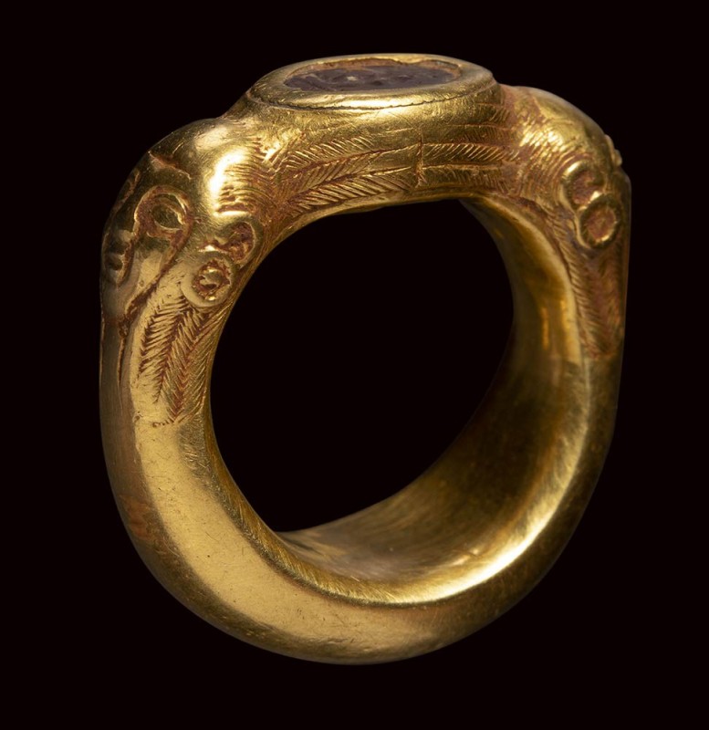 A rare etruscan agate intaglio set in an ancient massive gold ring. Silenus.

...