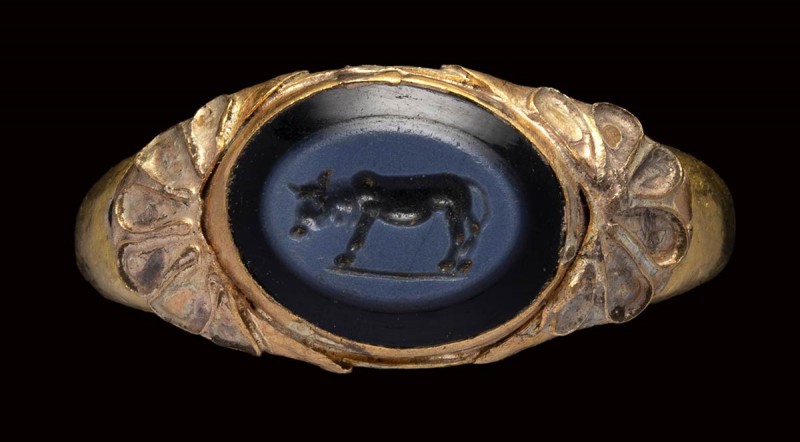 A roman nicolo intaglio set in an etruscan gold ring. Bull. 

intaglio: 1st-2n...
