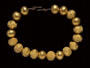 A group of 19 etruscan gold beads.