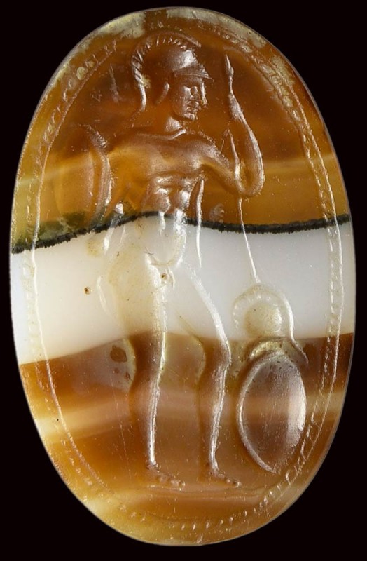 A fine and large banded agate roman italic intaglio. Warrior. 

2nd century B....