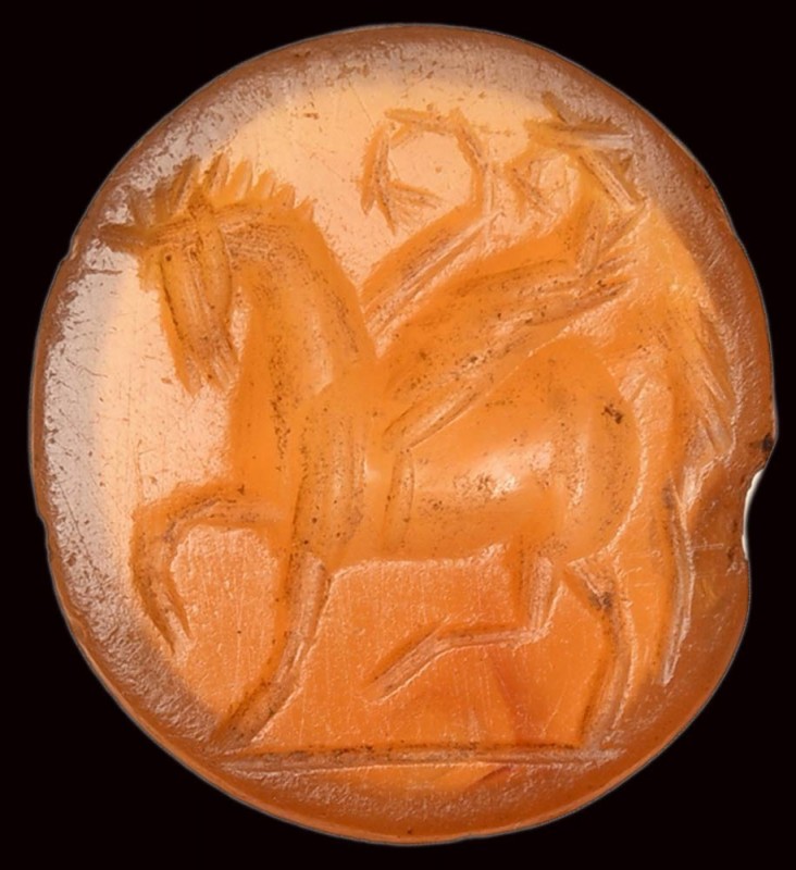 A roman carnelian intaglio. Pegasus. 

2nd century A.D.

9 x 10,5 x 2 mm

...