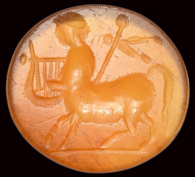 A roman carnelian intaglio. Centaur with attributes. 

2nd - 3rd century A.D....