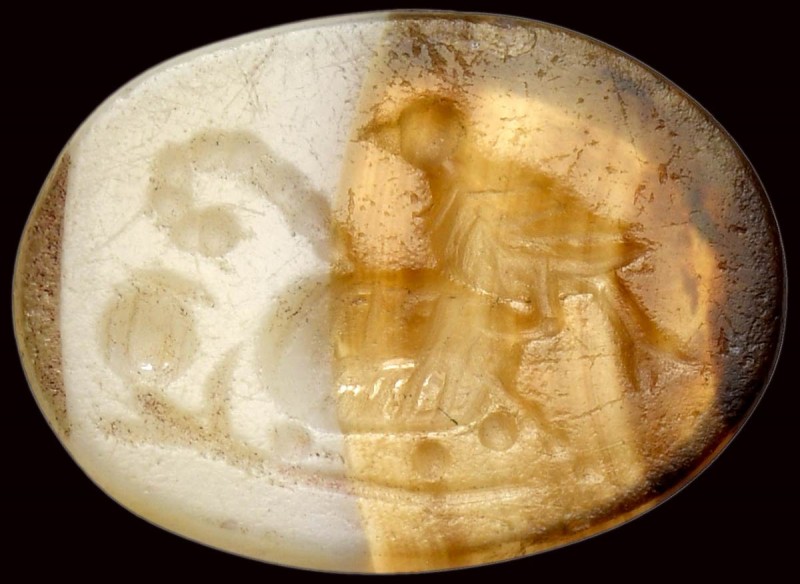 A roman italic banded agate intaglio. Bird with attributes. 

2nd-1st century ...