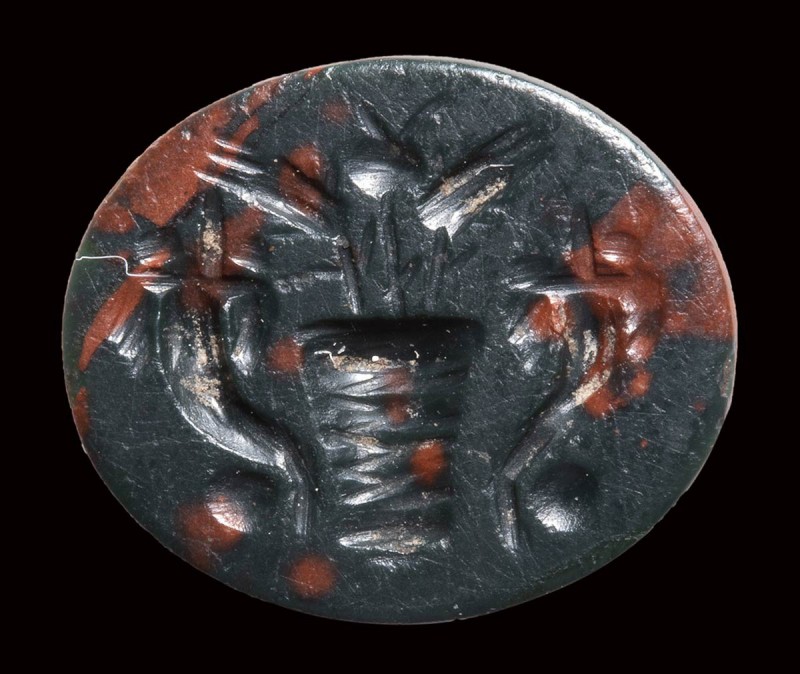A roman heliotrope intaglio. Allegorical emblema. 

2nd century A.D.

9 x 11...