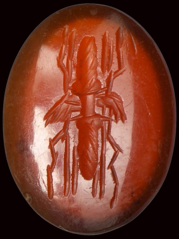 A roman deep red carnelian intaglio. Winged thunderbolt. 

1st - 2nd century A...
