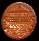 A roman carnelian intaglio. Galley with figures.