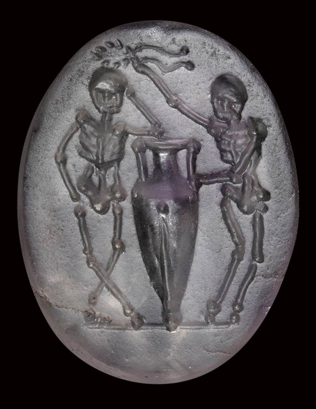 A roman republican amethyst intaglio. Two skeletons with amphora.

1st century...