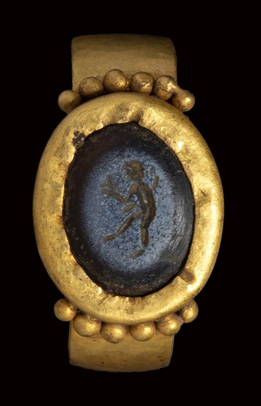 A roman nicolo intaglio set in an ancient gold ring. Faun.

2nd - 3rd century ...