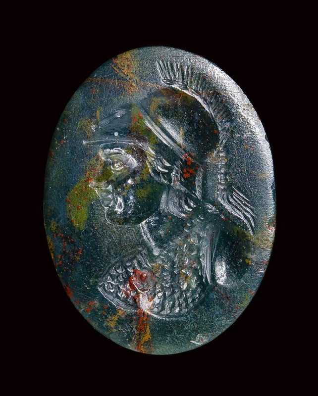 A large roman eliotrope intaglio. Bust of Athena. 

2nd - 4th century A.D.

...