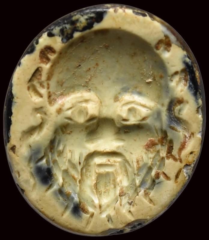 A roman burnt agate intaglio. Mask of Silenus. 

1st - 2nd century A.D.

10 ...