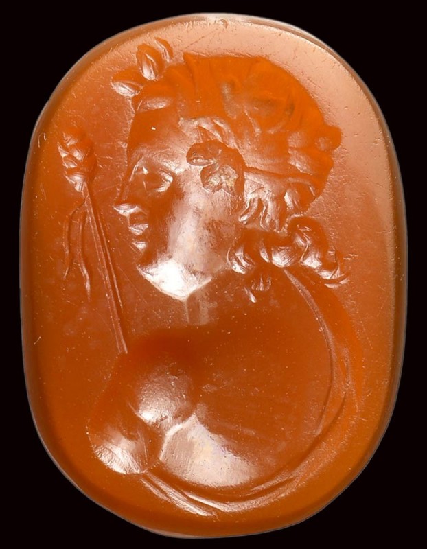 A roman sard intaglio. Dionysos bust. 

1st century B.C. - 2nd century A.D.
...