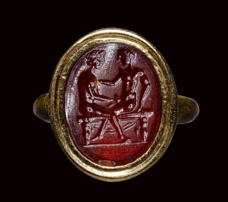 A roman carnelian intaglio mounted in a modern gold ring. Erotic scene.

2nd c...