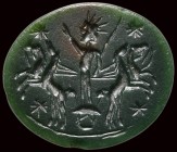 A roman green jasper astrological intaglio. Helios with solar quadriga.