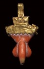 A gold and coral roman apotropaic phallic pendant.