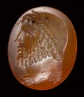 A large eastern roman carnelian  intaglio. Bearded male bust with astrological symbols.