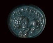 A sasanian green jasper stamp-seal. Lion and inscriptions.
