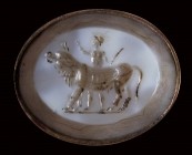 A postclassical agate-nicolo intaglio. Male figure with a bull.