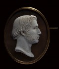 A 18K gold brooch set with a shell cameo signed JB Martin. Male portrait.