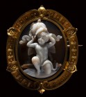 A very fine agate cameo by G.A. Girardet, set in a gold brooch. Eros with a Panoplia.