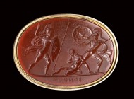 A fine neoclassic Poniatowski carnelian intaglio mounted on a gold ring. Achilles having killed Pilidorus, attacked by Hector.