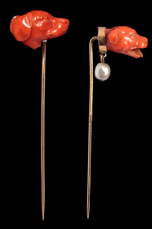 A lot of two Victorian coral cameo head of dog set in gold stick pin. 

19th c...