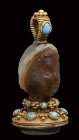 A fine banded agate seal set in a gold mounting with turquoise. Female head.