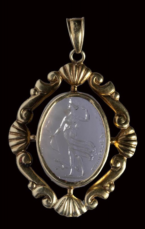 A chalcedony intaglio signed Tonnellier, set in a gold 14K pendant. Diana huntin...
