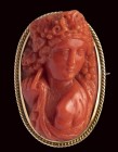 A fine Victorian coral cameo set in a gold brooch. Bacchante.