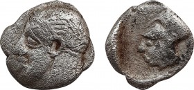 ASIA MINOR. Uncertain. 4th century BC. Tetartemorion.Obv: Male head (of Apollo?) to left, wearing taenia. Rev: Head of Athena to left, wearing Corinth...