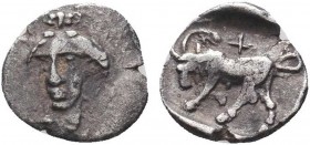 IONIA. Phygela. Hemiobol (Circa 400-380 BC).
Obv: Head of Artemis Munychia facing slightly left.
Rev: Bull butting left, palm frond and cross above;...