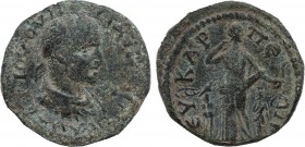 PHRYGIA. Eukarpeia. Maximinus I Thrax. 235-238.Ae. Obv: Laureled, draped and armored bust r. Rev: Artemis stands r. with bow, drawing an arrow out of ...