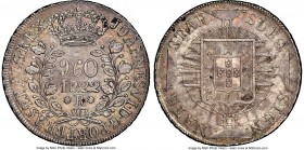 João VI 960 Reis 1822-R AU55 NGC, Rio de Janeiro mint, KM326.1, LMB-480. Overstruck on Argentina sun-face 8 Reales. Well-struck and lightly toned over...