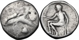 Greek Italy. Southern Apulia, Tarentum. AR Nomos, c. 470-425 BC. Phalantos riding dolphin left; below, shell. / Oecist seated left, holding distaff [a...