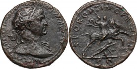 Trajan (98-117). AE Sestertius, 103-111. Bust right, laureate, draped on left shoulder. / Emperor prancing on horseback right, spearing Dacian below h...