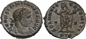 Constantine I (307-337). AE Follis, 317 AD, Trier mint. Bust right, laureate, cuirassed. / Sol standing left, wearing cloak, raising right hand and ho...