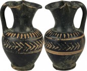 Xenon-Ware Oinochoe. The body with geometrical decorations in added red. Magna Grecia, late 4th century BC. H. 11 cm.