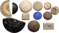 Lot of 12 board game stones of various shapes and materials (including a bright blue glass). Roman period, 1st-5th century AD.