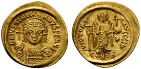 Justinian I (527-565), Solidus, Carthage, AD 546-547; AV (g 4,49; mm 20; h 6); Helmeted and cuirassed facing bust, holding globus cruciger, shield ove...