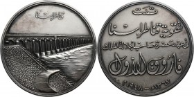 Egypt, Farouk, silver medal from 1948, Aswan Dam Silver 53,31 g. Diameter: 51 mm. Srebro, waga 53,31 g, średnica 51 mm.

Grade: AU 

Egypt