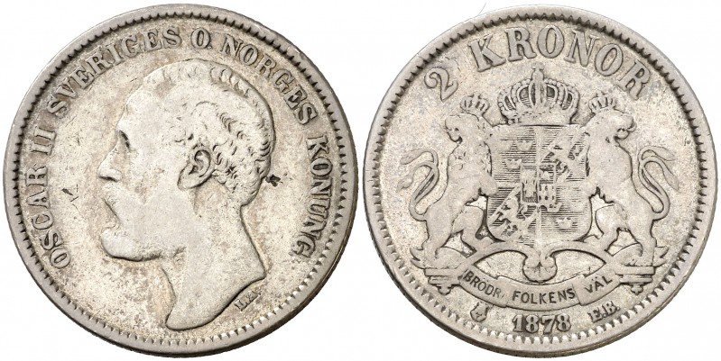 1878. Suecia. Óscar II. EB. 2 coronas. (Kr. 742). 14,61 g. AG. Rara. BC+.