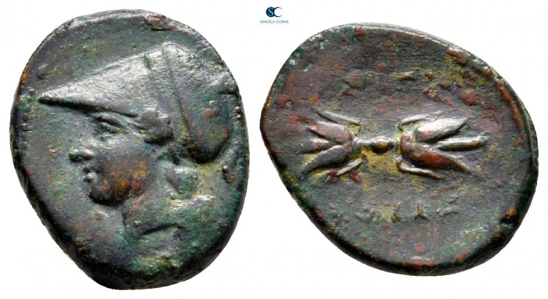 Sicily. Syracuse circa 305-295 BC. 
Trias Æ

14 mm, 2,12 g

Head of Athena ...