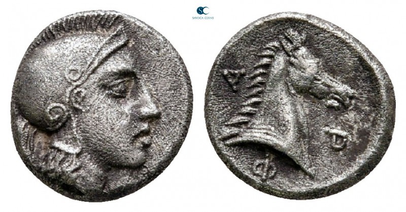 Thessaly. Pharsalos circa 450-420 BC. 
Obol AR

9 mm, 1,00 g

Helmeted head...