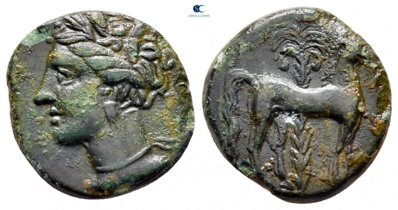 Zeugitana. Carthage circa 400-350 BC. 
Bronze Æ

14 mm, 2,20 g

Wreathed he...