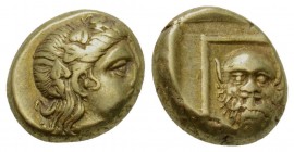 Greek, Lesbos, c. 377-326 BC, EL Hect, Mytilene
Obverse: Wreathed head of young Dionysos right
Reverse: Facing head of Silenos within linear square...