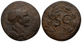 Trajan Æ28 of Antioch, Syria. c. 102-114. 
Laureate head r. / S C within laurel wreath. Condition Very Good 6.9 gr. 23 mm.
