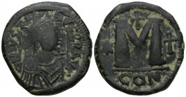 Justin I AD 518-527. 
Constantinople, Follis Æ, Obv: D N IVSTINVS P P AVG, pearl diademed, draped, and cuirassed bust right / Large M, star, cross ab...