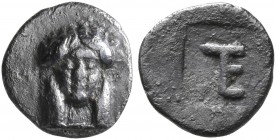 IONIA. Kolophon. Circa 500-450 BC. Tetartemorion (Silver, 7 mm, 0.25 g, 10 h). Facing head of Apollo. Rev. Monogram of TE (mark of value) within incus...