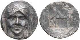 IONIA. Kolophon. Circa 450-410 BC. Hemiobol (Silver, 9 mm, 0.48 g, 3 h). Facing laureate head of Apollo between two laurel leafs. Rev. Monogram of HM ...