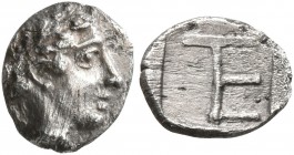 IONIA. Kolophon. Circa 450-410 BC. Tetartemorion (Silver, 7 mm, 0.32 g, 2 h). Laureate head of Apollo to right. Rev. Monogram of TE (mark of value) wi...