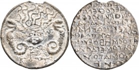 ASIA MINOR. Uncertain. Amulet (Lead, 35 mm, 13.25 g, 12 h), circa 4th-6th centuries. Facing gorgoneion with wild hair and protruding tongue; to left a...